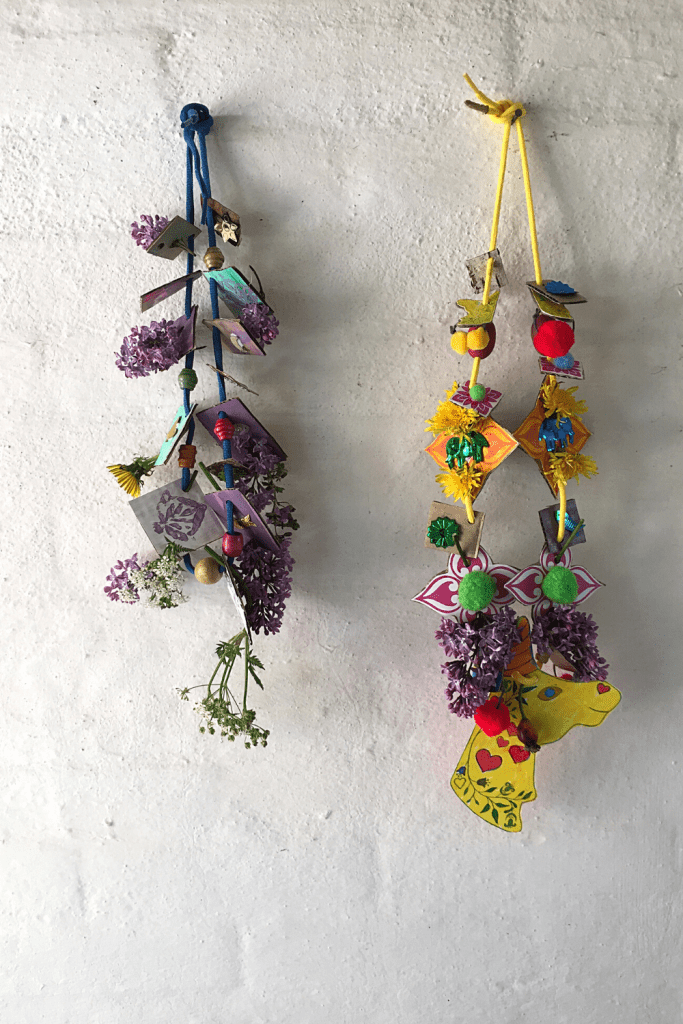 Two necklaces are made from found objects. 