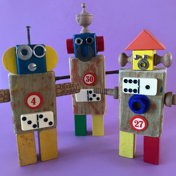 Robots are assembled from scraps of wood and other items like screws, dominoes, etc.