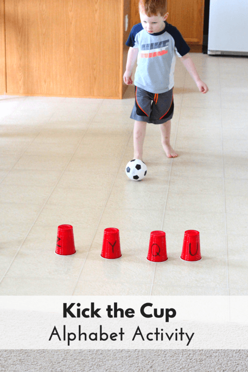 Boy playing kick the cup, as an example of gross motor activities.