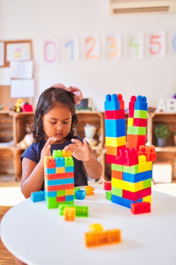 child playing with blocks 