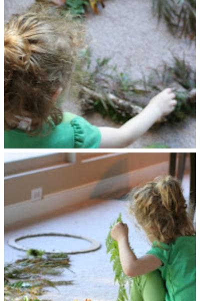 A young girl makes a nature wreath
