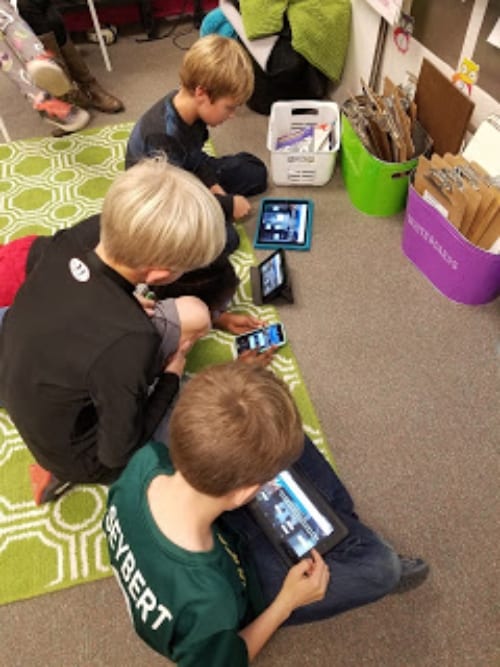 classroom children on iPads