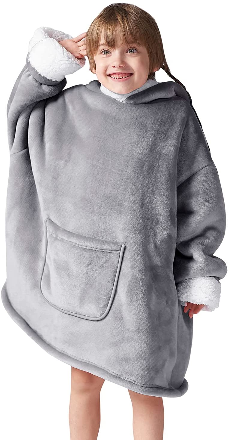 Young kid in light gray wearable blanket