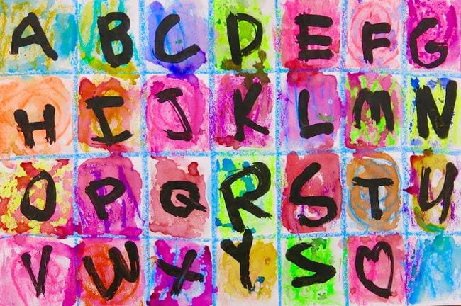 Paper divided into squares and painted different colors, with a letter of the alphabet in each square (KIndergarten Art Projects)