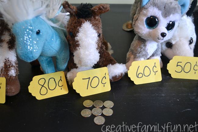 Stuffed animals labeled with price tags in increments of 10 cents, used for kindergarten math games