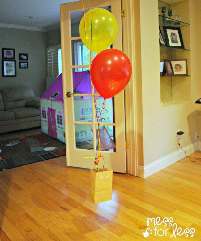 Helium balloons floating with a bag attached to the string