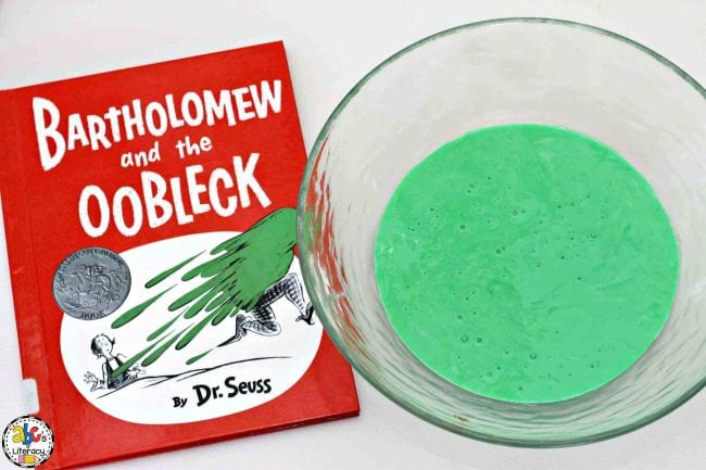 Bartholomew and the Oobleck book next to a bowl of thick green liquid