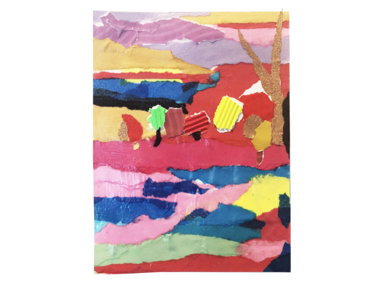 A landscape is created by layering different scraps of brightly colored paper.