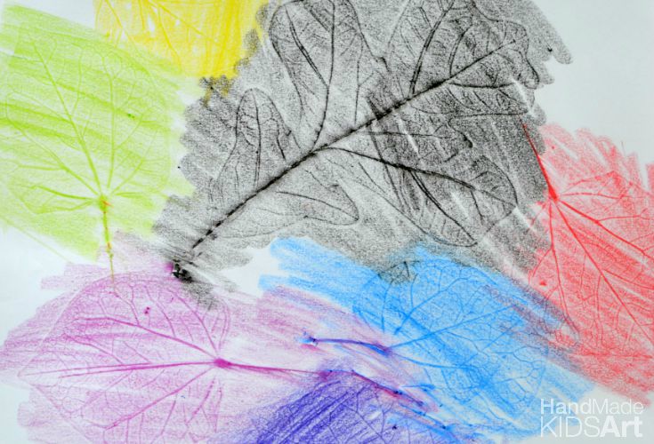 Colorful leaf rubbings on a sheet of paper