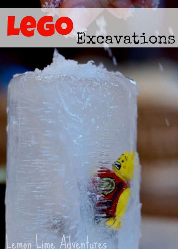 A Lego man is shown hanging partly out of a block of ice that it has been frozen into.