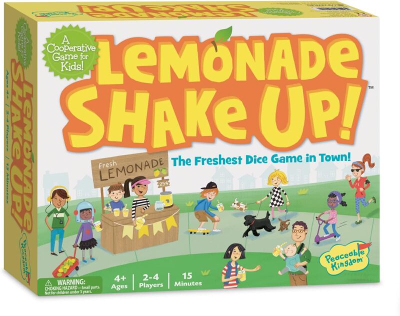 A cartoon on a box cover shows a park with a lemonade stand. Large yellow and orange letters say Lemonade shake up!
