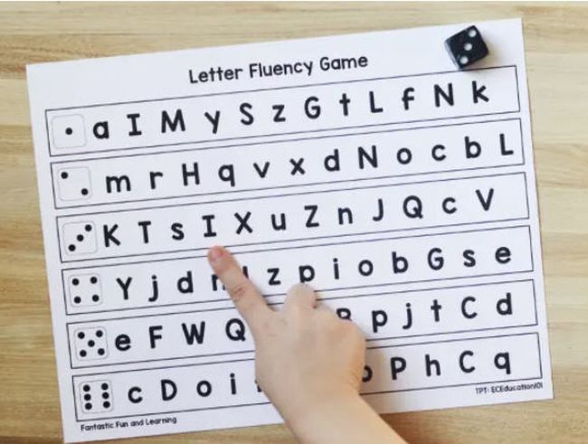 Printable letter naming worksheet with rows of letters