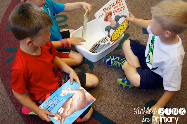 Students sitting on the floor organizing books as an example of fun last day of school activities