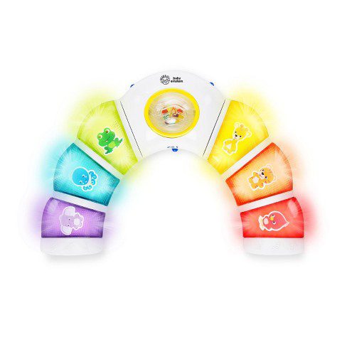 A half moon shaped toys has different colored buttons on it (sensory toys)