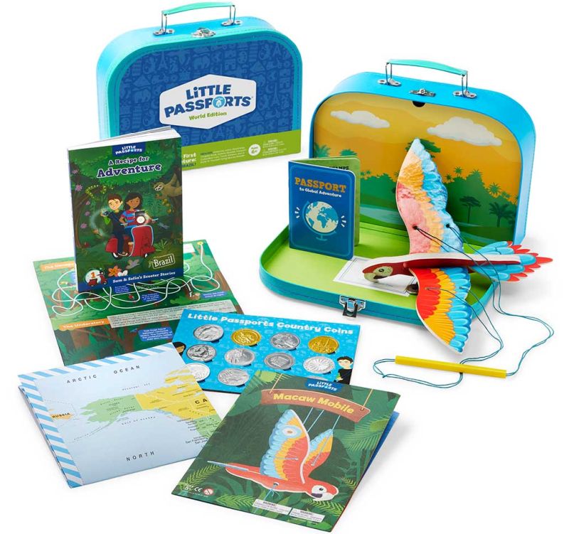 Little Passports educational subscription box with books, coins, paper bird craft, and more country-themed items