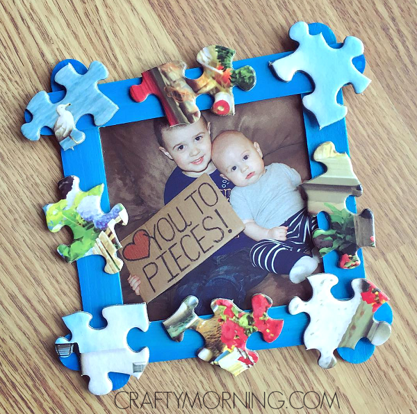 The best Father's Day crafts for kids often include photos like this homemade picture from with puzzle pieces glued to it. A picture of two young boys is inside with the words heart you to pieces!