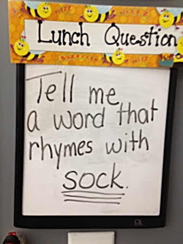 A classroom poster with a lunch question "Tell me a word that rhymes with sock" as an example of exit tickets in the classroom