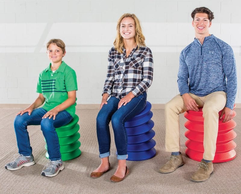 Students and adults sitting on ErgoErgo Seat accordion chairs (Flexible Seating Options)