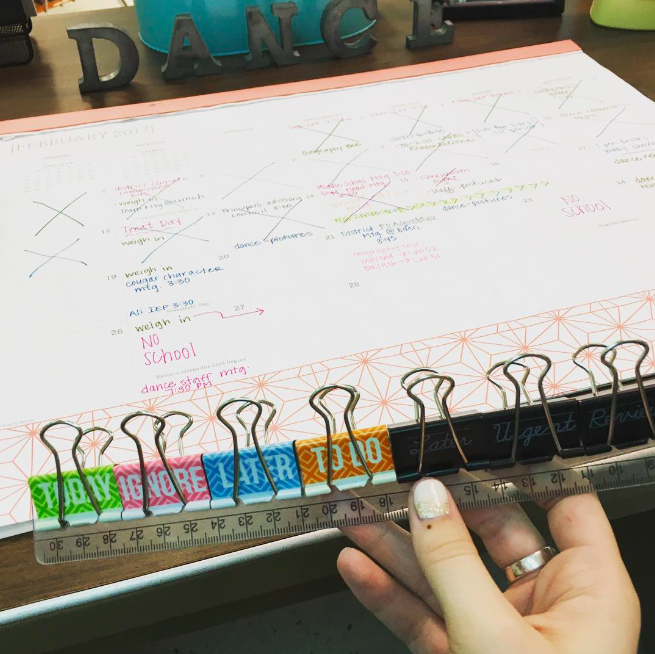 Color-coded and labeled binder clips help with classroom organization