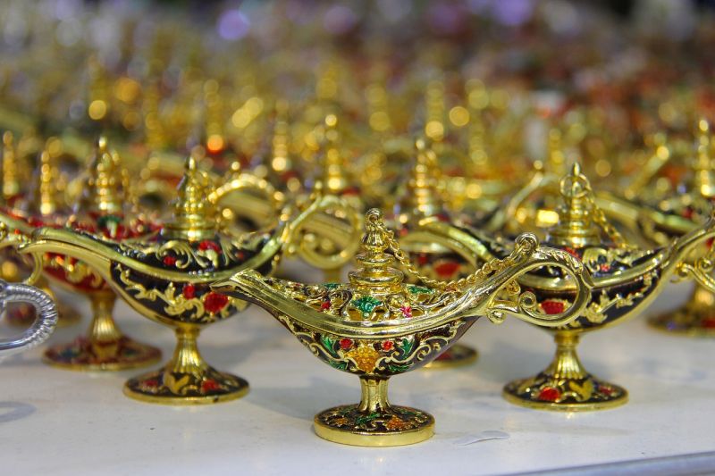 A collection of green "genie" lamps studded with gems