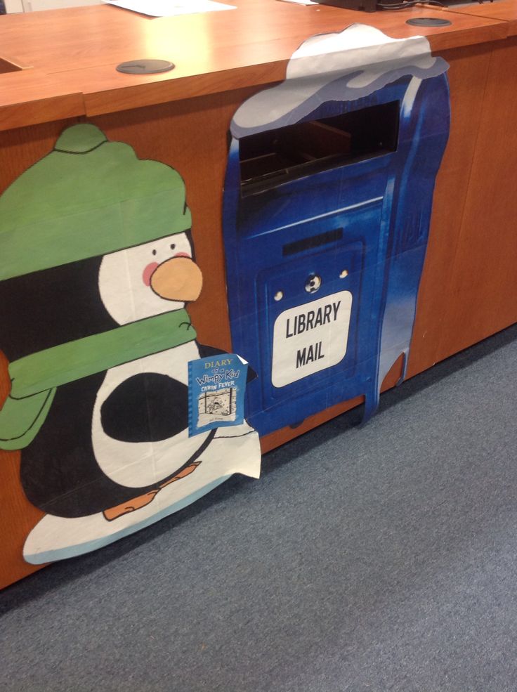 library drop box decorated like a mailbox