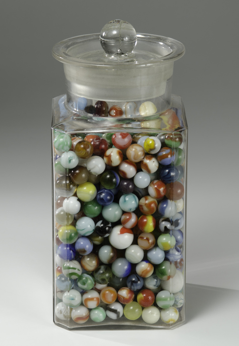 Marble games include guess how many marbles like this glass jar that is filled with colorful marbles