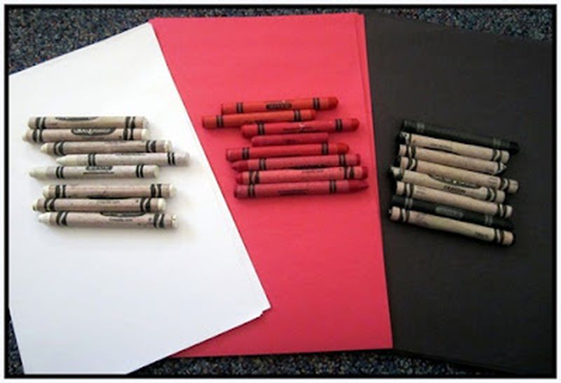 White, red, and black construction paper and crayons
