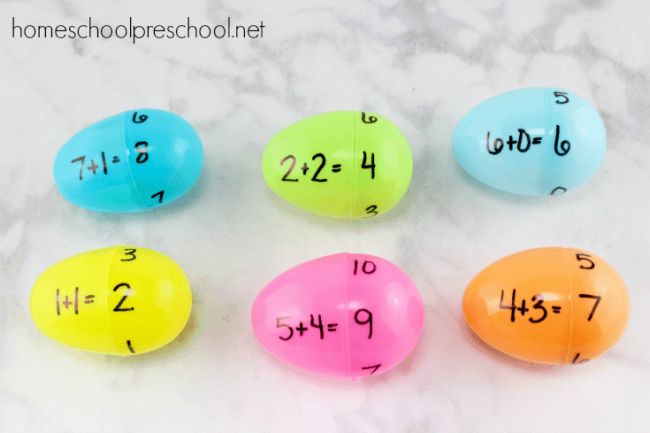 Plastic Easter eggs with addition math facts written on one half and sums on the other half- math facts games