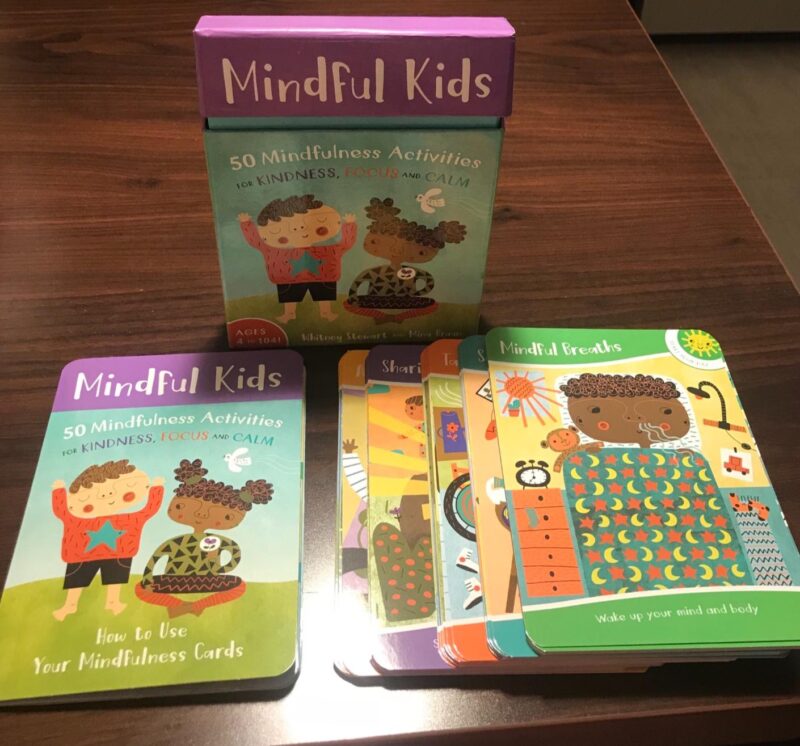 A deck of mindfulness cards for kids on a table as an example of a brain break.