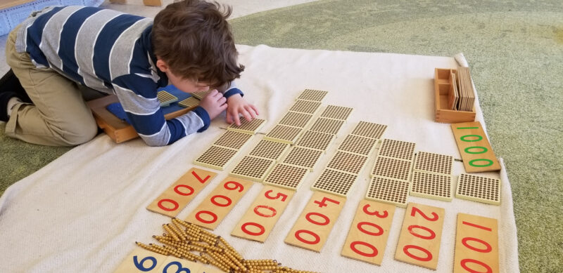 photo-of-a-boy-working-on-montessori-math-activity