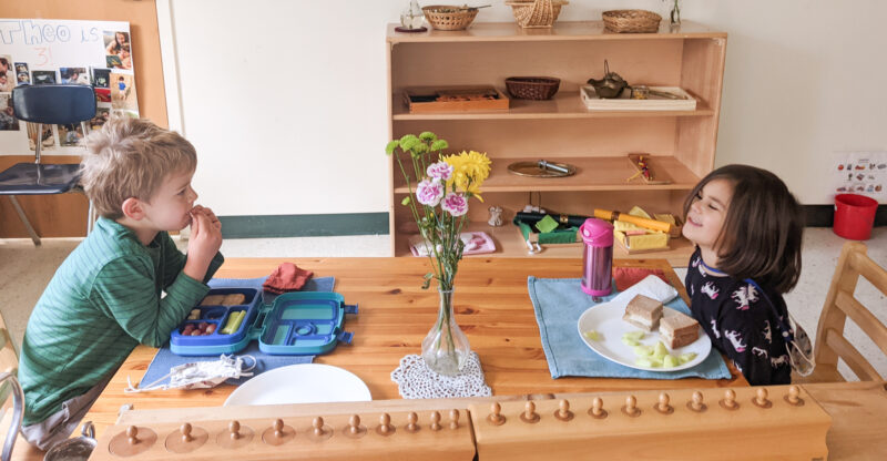 photo-of-two-children-eating-at-montessori-table