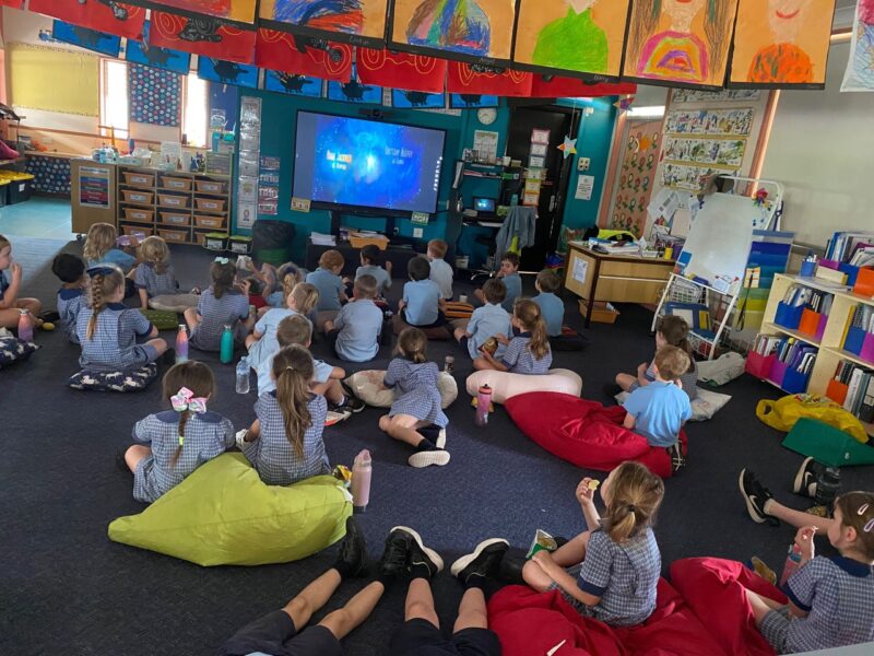 kids watching a movie for an incentive 