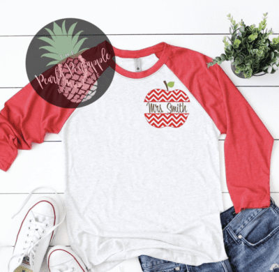 Red and white baseball tee with Mrs. Smith written inside an apple