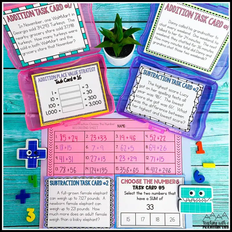 A math lesson set up with task cards and worksheet laid out on a table