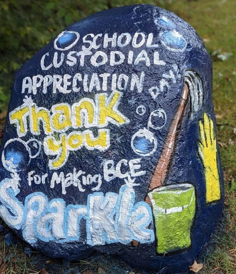 A rock painted for National School Custodian Appreciation Day, saying "thank you for making BCE sparkle"