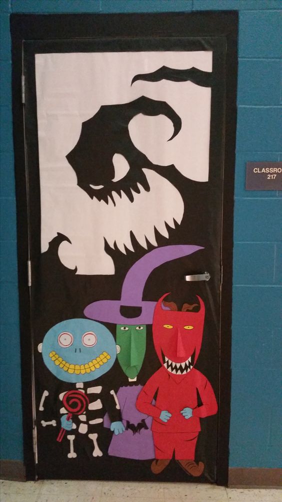 FAll bulletin boards include doors like this one decorated to look like a scene from the movie The Nightmare Before Christmas. A silhouette of the villain is in black and three child sized trick or treaters from the movie are in the front.