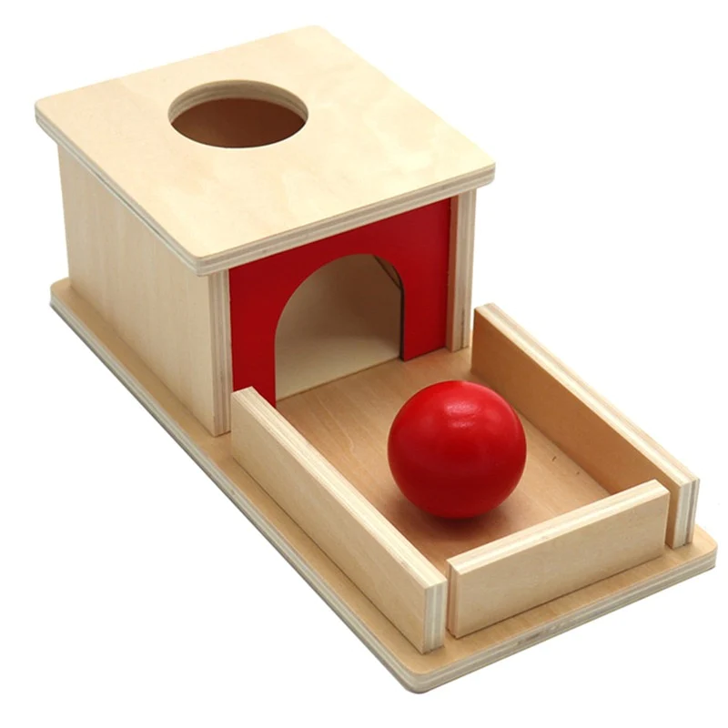 Wooden object permanence box as example of Montessori toys