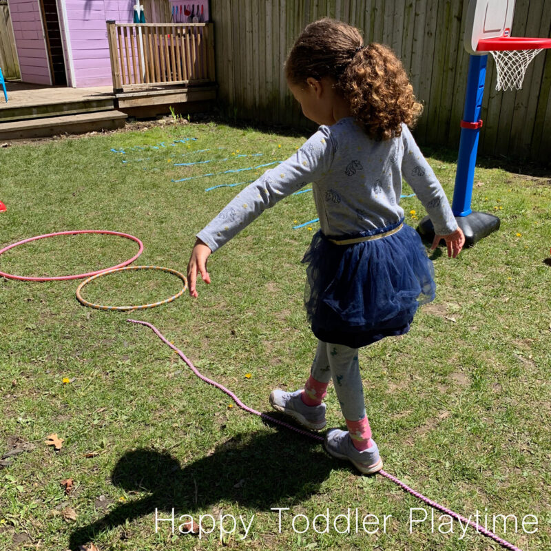 Girl walking along an obstacle course 