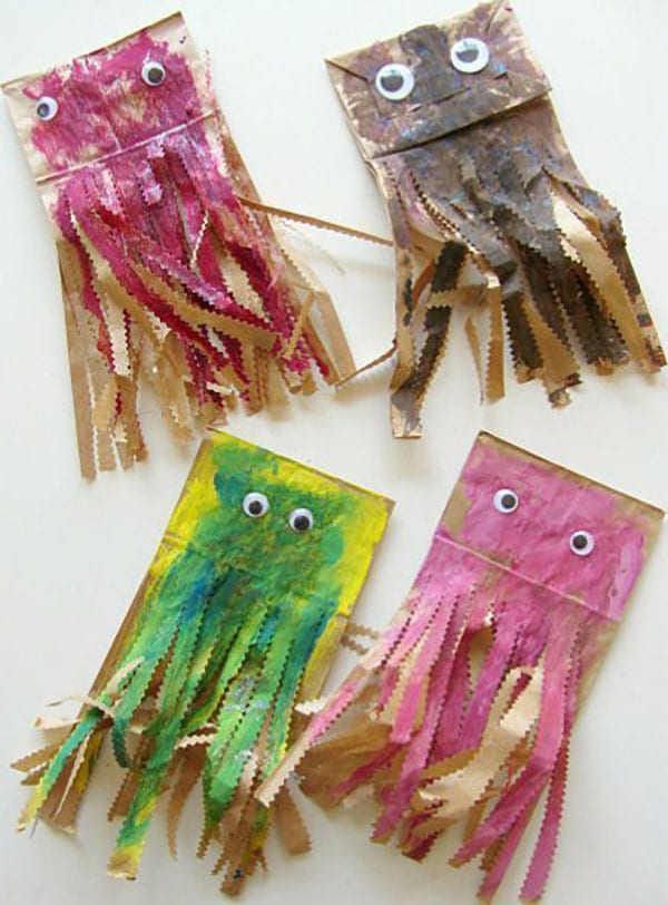 Four jellyfish are made from paper bags and paint.