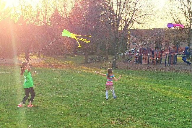 Outdoor science activities can include children flying homemade kites in the evening