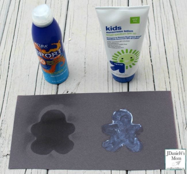 Two kinds of sunscreen with a piece of black construction paper 