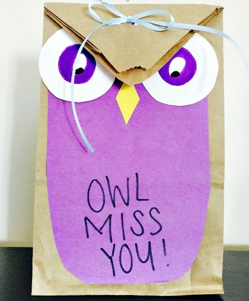 A paper bag is decorated as an owl