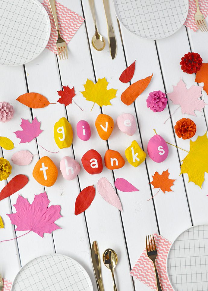 painted rocks spelling out "give thanks"