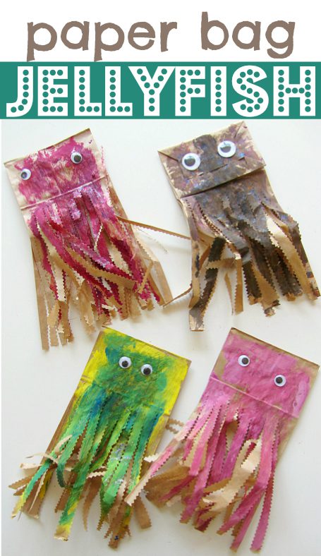 Text at the top says Paper Bag Jellyfish. Four paper bags have been painted with googly eyes glued on them. The bottom of the bags have been shredded with scissors.