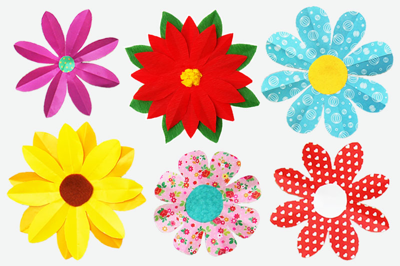 Six different paper flowers are shown in different shapes and colors. 