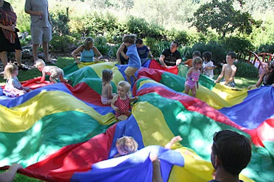 kids playing on a parachute