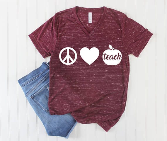 Peace love teacher symbols shirt, as an example of Etsy teacher shirts