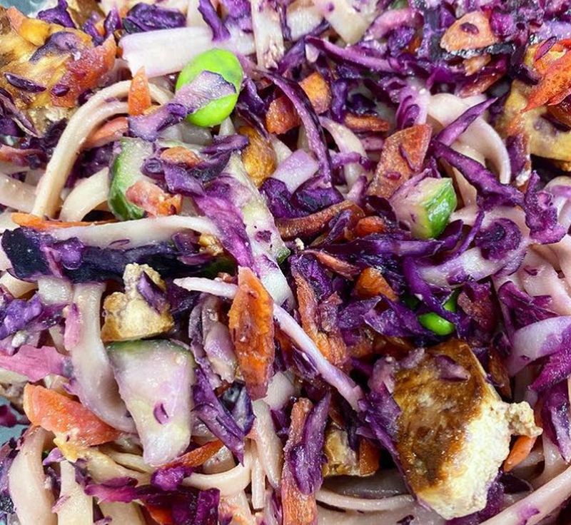 Salad made of rice noodles, cabbage, tofu, vegetables, and peanuts
