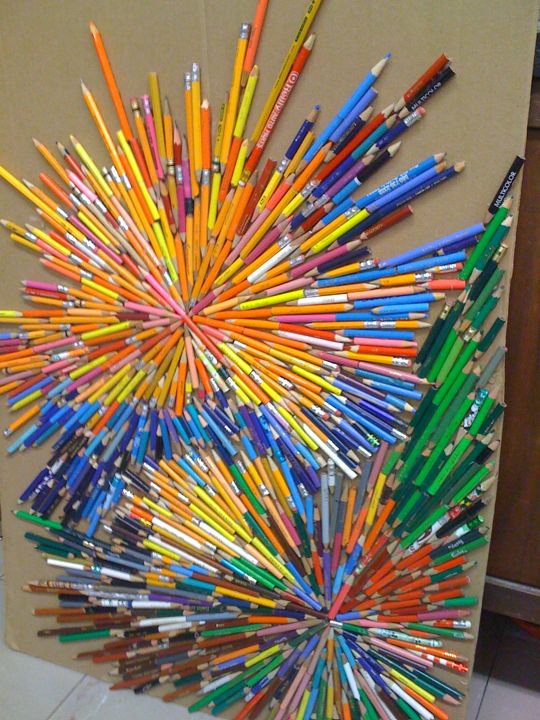 A colorful sunburst is created from pencils