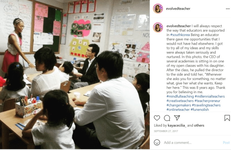 Teacher standing at front of class with students in South Korea